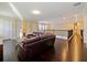 Cozy upstairs living area with wood floors, comfortable seating, and natural light at 3687 Farm Bell Pl, Lake Mary, FL 32746