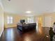 Spacious living room with hardwood floors and comfortable seating arrangements at 3687 Farm Bell Pl, Lake Mary, FL 32746