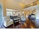 Living room featuring high ceilings, open floor plan, second story, and a view of the kitchen and staircase at 3687 Farm Bell Pl, Lake Mary, FL 32746