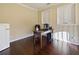 Comfortable home office with hardwood floors, desk, and natural light from the window at 3687 Farm Bell Pl, Lake Mary, FL 32746