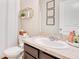 Bathroom features a vanity with a solid surface countertop and gold accents at 3807 Night Heron Dr, Sanford, FL 32773