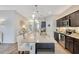 Modern kitchen with granite countertops, stainless steel appliances, and island with seating at 3807 Night Heron Dr, Sanford, FL 32773
