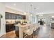 Modern kitchen with granite countertops, stainless steel appliances, and island with seating at 3807 Night Heron Dr, Sanford, FL 32773
