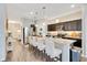 Modern kitchen with granite countertops, stainless steel appliances, and island with seating at 3807 Night Heron Dr, Sanford, FL 32773