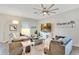 Spacious living room with comfortable seating, bright natural light, and modern decor at 3807 Night Heron Dr, Sanford, FL 32773