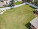 Aerial view of the property highlighting its expansive backyard and perimeter fencing at 385 Woodland Ave, Daytona Beach, FL 32118