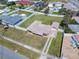 Aerial view showcasing a home with a large yard, fenced perimeter and proximity to neighborhood amenities at 385 Woodland Ave, Daytona Beach, FL 32118