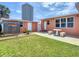 Spacious backyard featuring a shed and outdoor shower at 385 Woodland Ave, Daytona Beach, FL 32118