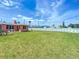 Extensive backyard area enclosed with a white perimeter fence at 385 Woodland Ave, Daytona Beach, FL 32118