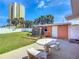 View of backyard with a storage shed and an outdoor shower at 385 Woodland Ave, Daytona Beach, FL 32118