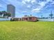Large backyard area with building in the background at 385 Woodland Ave, Daytona Beach, FL 32118