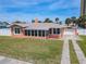Exterior angle of lovely home with well-maintained landscaping and appealing architectural details at 385 Woodland Ave, Daytona Beach, FL 32118