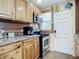 Cozy kitchen featuring stainless steel appliances, and decorative fish wall hangings at 385 Woodland Ave, Daytona Beach, FL 32118