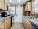 Well-equipped kitchen features stainless steel appliances and light wood cabinetry at 385 Woodland Ave, Daytona Beach, FL 32118