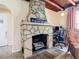 Living room with stone fireplace and wooden accents, perfect for relaxing and working from home at 385 Woodland Ave, Daytona Beach, FL 32118
