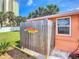 Wooden outdoor shower with 'Paradise' sign in the backyard at 385 Woodland Ave, Daytona Beach, FL 32118