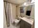 Bathroom with shower-tub, toilet, vanity, and a fun painting on the wall at 400 E Orlando Ave # 10 C, Ocoee, FL 34761