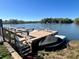 Private boat dock on the lake with seating, stairs, and boats ready for boating at 400 E Orlando Ave # 10 C, Ocoee, FL 34761