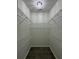 Walk-in closet features plentiful shelving and modern light fixture at 403 Britten Dr, Kissimmee, FL 34758