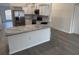 Kitchen features stainless steel appliances, gray countertops, and white subway tile backsplash at 403 Britten Dr, Kissimmee, FL 34758