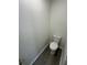 Toilet room with modern toilet and grey vinyl flooring at 403 Britten Dr, Kissimmee, FL 34758