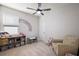 Playful bedroom with a comfortable chair and organized toy storage at 4439 Davos Dr, Clermont, FL 34711