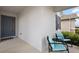 Inviting front porch with elegant blue door, seating, and a welcoming atmosphere at 4439 Davos Dr, Clermont, FL 34711