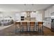 The kitchen features a large island with seating, modern appliances, and stylish finishes at 4439 Davos Dr, Clermont, FL 34711