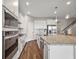 Bright kitchen with stainless appliances, large island, granite counters, and pendant lighting at 4439 Davos Dr, Clermont, FL 34711