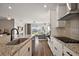 This is a well-equipped kitchen with a granite island, modern appliances, and open floor plan at 4439 Davos Dr, Clermont, FL 34711