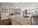 Gleaming granite countertops highlight the kitchen island with seating and pendant lighting above at 4439 Davos Dr, Clermont, FL 34711