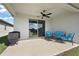An outdoor patio with a ceiling fan and sliding glass doors, perfect for enjoying the outdoors at 4439 Davos Dr, Clermont, FL 34711