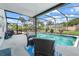 Covered patio with a view of the screened in pool and backyard at 4451 Seawater Street, Orlando, FL 32812