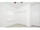Bright bedroom features a closet and a window with blinds at 4765 Sw 128Th St, Ocala, FL 34473