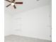 This bedroom is complete with tile floors, ceiling fan and a window for natural light at 4765 Sw 128Th St, Ocala, FL 34473