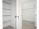 Closet featuring metal shelving, tile floors, and white interior walls at 4765 Sw 128Th St, Ocala, FL 34473