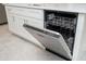 Stainless steel dishwasher with white shaker style cabinetry and granite countertops at 4765 Sw 128Th St, Ocala, FL 34473