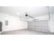 Spacious garage with white walls and a closed garage door at 4765 Sw 128Th St, Ocala, FL 34473