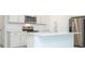 Well-equipped kitchen with stainless steel appliances, ample cabinetry, and a center island at 4765 Sw 128Th St, Ocala, FL 34473