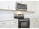 Contemporary kitchen with sleek appliances, granite countertops, and modern fixtures at 4765 Sw 128Th St, Ocala, FL 34473