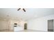 Large living room adjacent to the kitchen with tile floors, ceiling fan, and recessed lighting at 4765 Sw 128Th St, Ocala, FL 34473