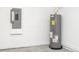 Hot water heater and fuse panel along a block wall in the garage at 4765 Sw 128Th St, Ocala, FL 34473