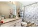 Well-lit bathroom features a granite countertop, a modern sink, and a marble shower at 4915 Pocahontas Ln, Lakeland, FL 33810