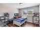 This bedroom has wood floors, a desk for studying, and a television for entertainment at 4915 Pocahontas Ln, Lakeland, FL 33810