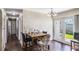 Cozy dining area with a faux brick wall, a view to the backyard, and seating for four at 4915 Pocahontas Ln, Lakeland, FL 33810