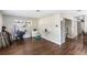Open-concept area showcases dark wood floors, ample lighting, and seamless transitions to other living spaces at 4915 Pocahontas Ln, Lakeland, FL 33810