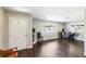 Spacious living room with dark wood floors, a large window, and a welcoming atmosphere at 4915 Pocahontas Ln, Lakeland, FL 33810
