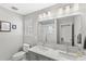 Well-lit bathroom features a double sink vanity with modern fixtures and a glass shower at 5898 Soter Ln, Windermere, FL 34786