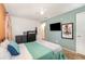 Comfortable bedroom with blue accent wall and modern furnishings at 6 Winding Ridge Rd, Casselberry, FL 32707