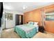 Cozy bedroom with carpeted floors, natural light, and a dark wardrobe at 6 Winding Ridge Rd, Casselberry, FL 32707